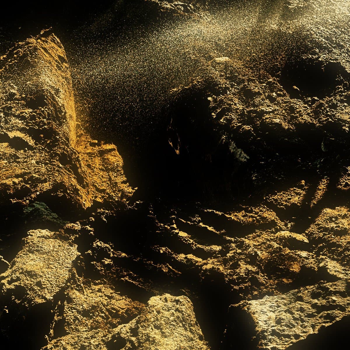 Water sprayed in an arc across broken rock in an open cut to keep dust down while the material is worked