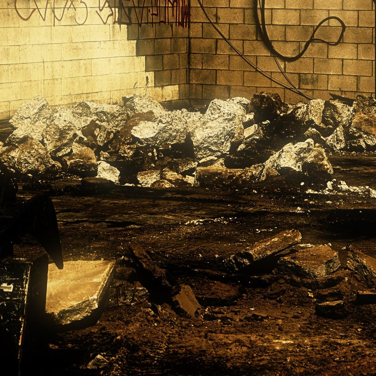 Broken concrete and asphalt stacked ready for loading at the edge of a cleared commercial lot, a loader bucket standing in the foreground