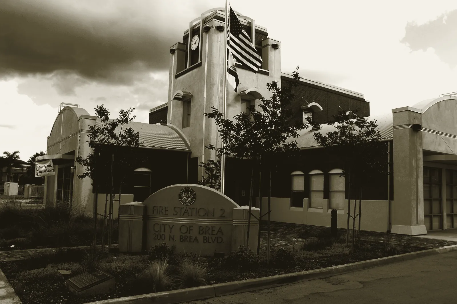 Brea Fire Station No. 2 completed in 2003, brick and stucco engine house with the flag flying