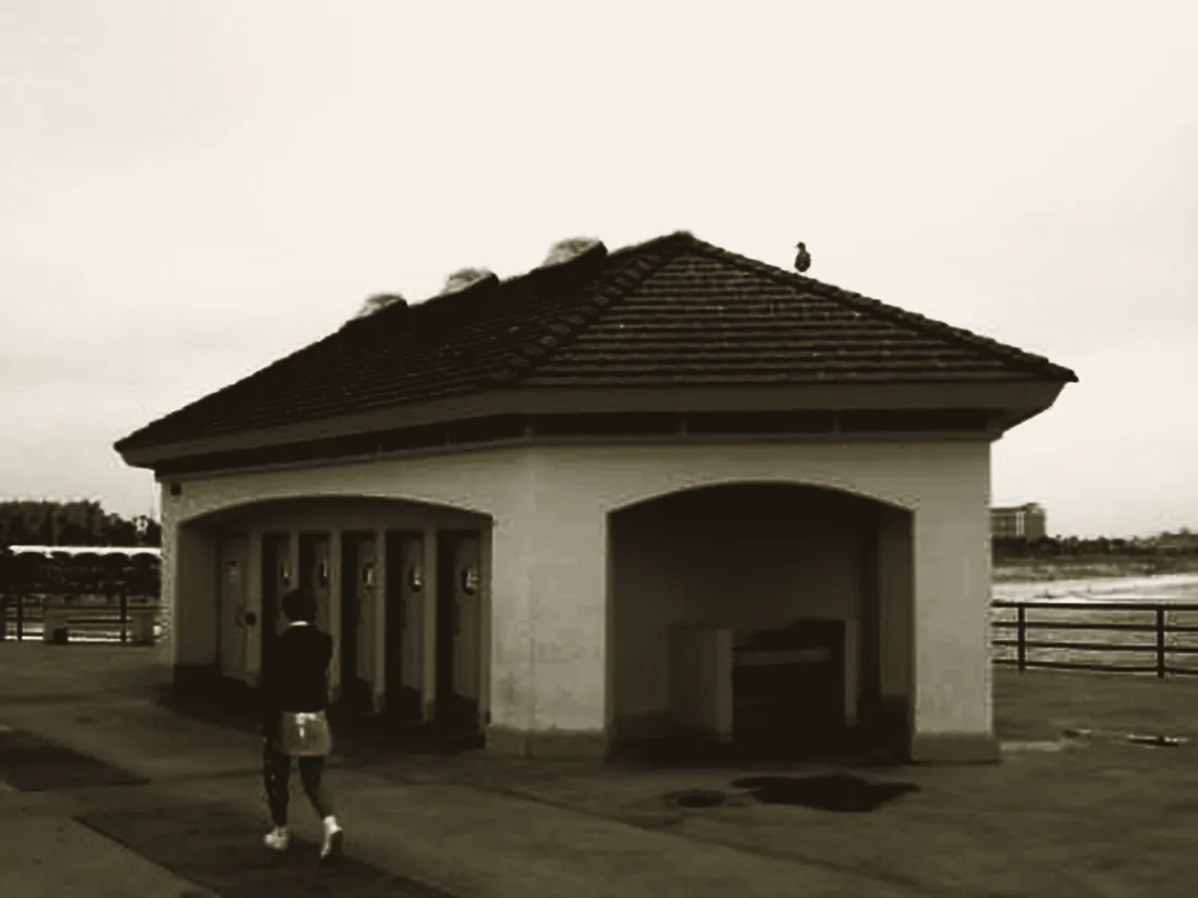 The remodelled restroom building on Huntington Beach pier, tiled roof and arched openings